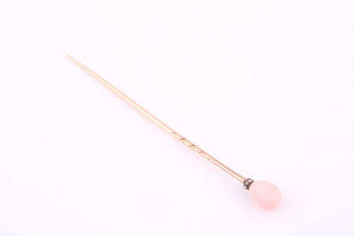Lot 24 - A conch pearl stick pin, the pink conch pearl...