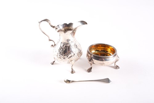 Lot 338 - A George III silver baluster cream jug, London...