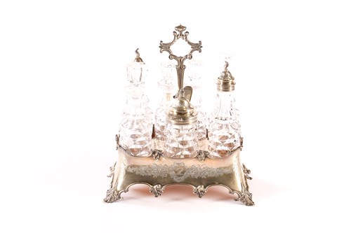 Lot 378 - A Victorian silver seven bottle table cruet...