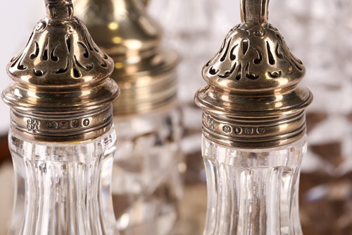 Lot 378 - A Victorian silver seven bottle table cruet...