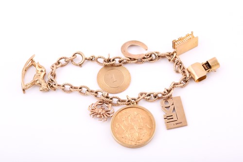 Lot 117 - A 9ct yellow gold charm bracelet with eight...