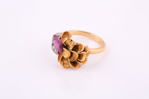 Lot 17 - An 18 carat yellow and white gold ruby and...