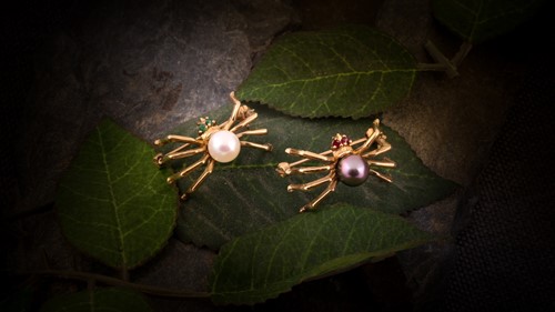 Lot 84 - A pair of pearl spider brooches, the first...