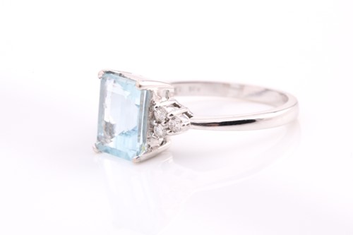 Lot 230 - An 18ct gold aquamarine and diamond ring, with...
