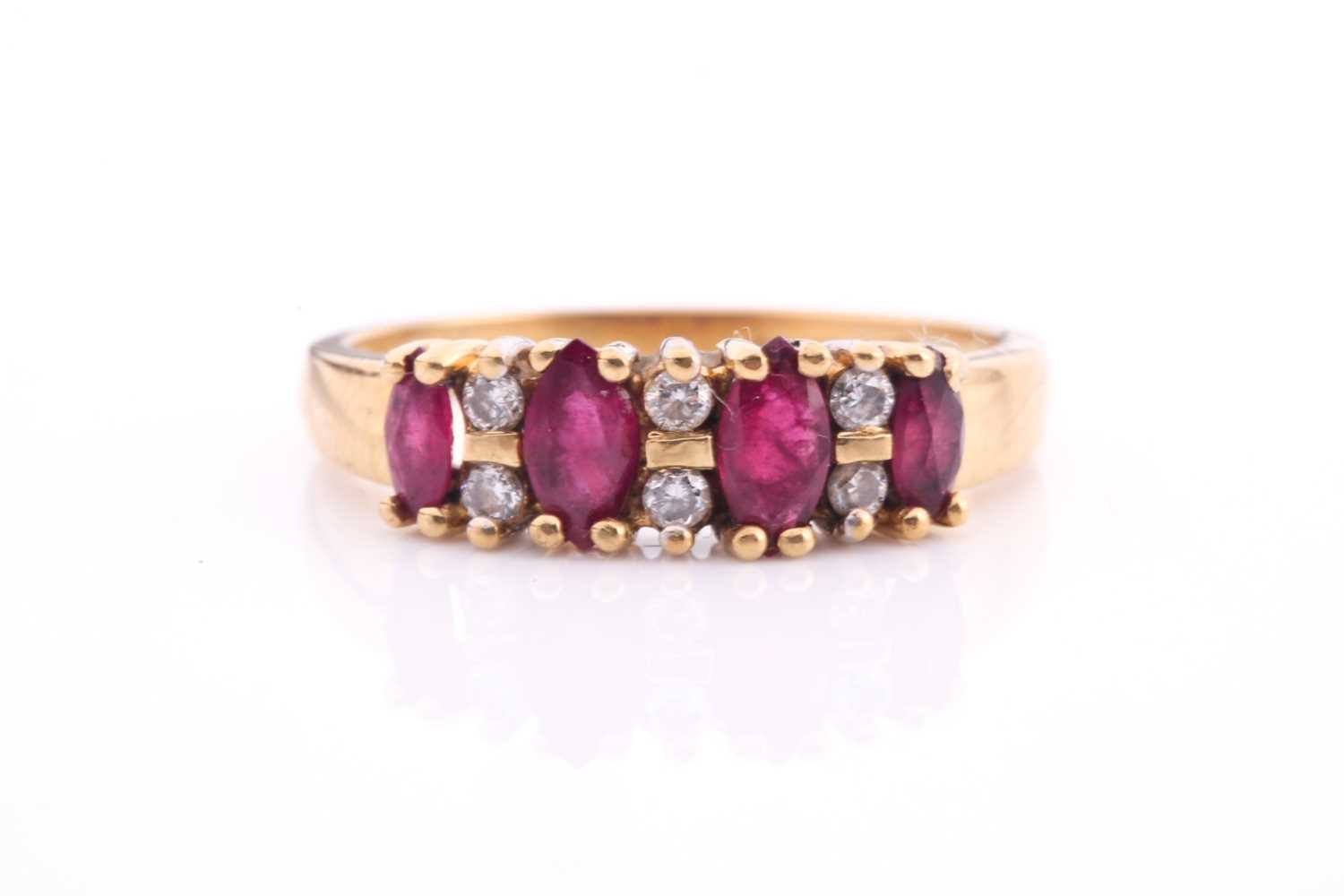 Lot 31 - An 18ct yellow gold, ruby and diamond eternity...