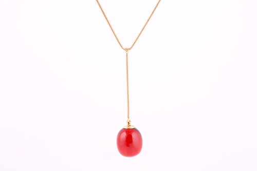 Lot 74 - A Baccarat red crystal egg pendant necklace,...