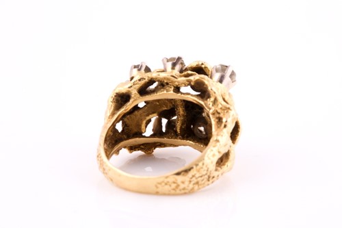 Lot 86 - A diamond cocktail ring set in yellow metal,...
