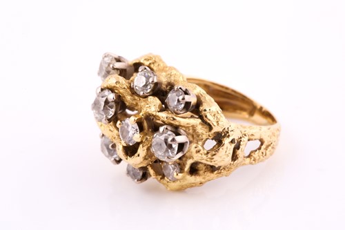 Lot 86 - A diamond cocktail ring set in yellow metal,...