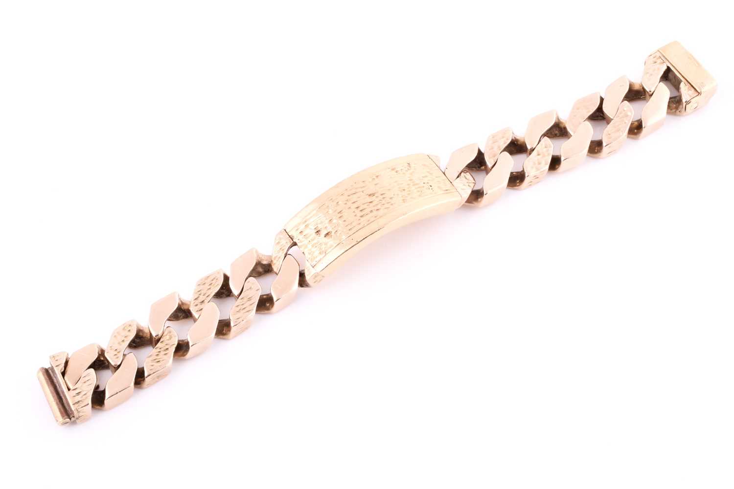 Lot 234 - A 9ct yellow gold heavy curb link ID bracelet,...