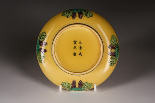 Lot 229 - A Chinese porcelain yellow grounf saucer,...