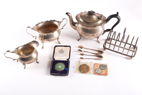 Lot 354 - A George V three-piece silver tea set, Chester...