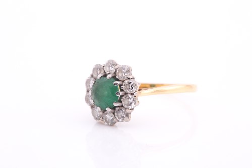 Lot 81 - An 18ct gold emerald and diamond cluster ring,...