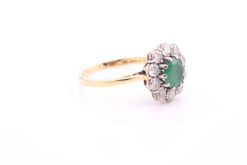 Lot 81 - An 18ct gold emerald and diamond cluster ring,...