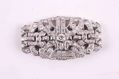 Lot 12 - An Art Deco diamond lapel brooch, the large...
