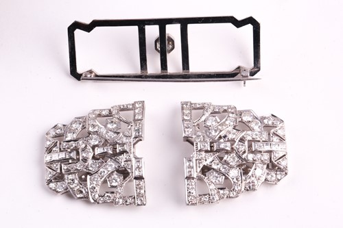Lot 12 - An Art Deco diamond lapel brooch, the large...