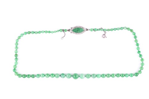 Lot 7 - A jade bead necklace, circa 1930, beads...