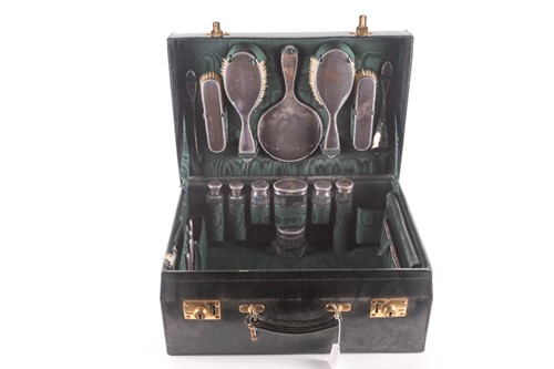 Lot 330 - A Walker & Hall silver traveling dressing...