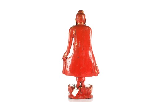 Lot 98 - A Burmese carved wood and cinnabar lacquered...