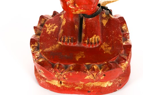 Lot 98 - A Burmese carved wood and cinnabar lacquered...