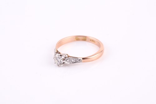 Lot 21 - A single stone diamond ring, the round...