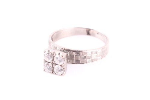 Lot 54 - A four stone diamond ring, the round brilliant...