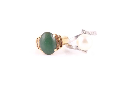Lot 238 - A jade and diamond ring, to a tapering yellow...