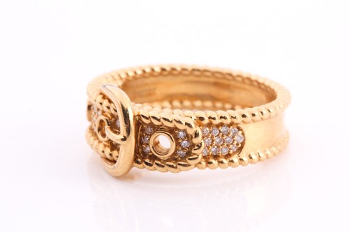 Lot 175 - A diamond-set buckle ring in yellow metal,...