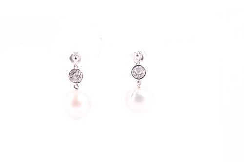 Lot 298 - A pair of diamond and pearl drop earrings, set...