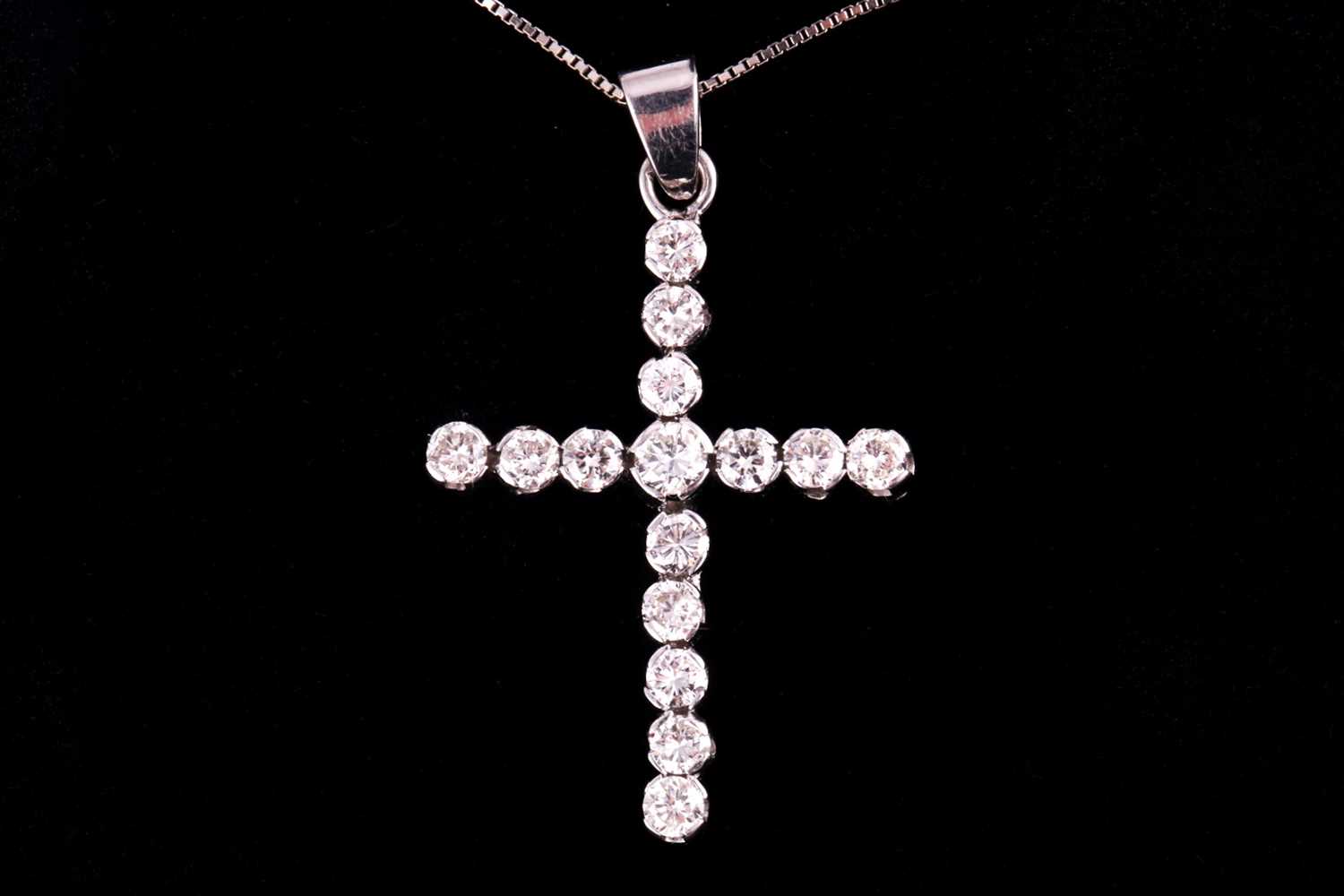 Lot 10 - A diamond set cross and chain, set with round...