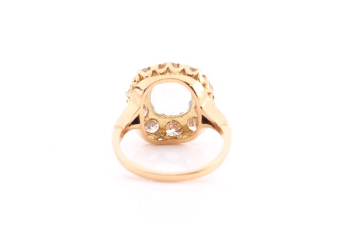 Lot 70 - An aquamarine and diamond cluster ring, set...