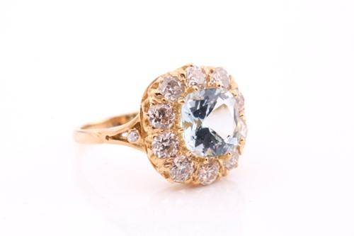 Lot 70 - An aquamarine and diamond cluster ring, set...