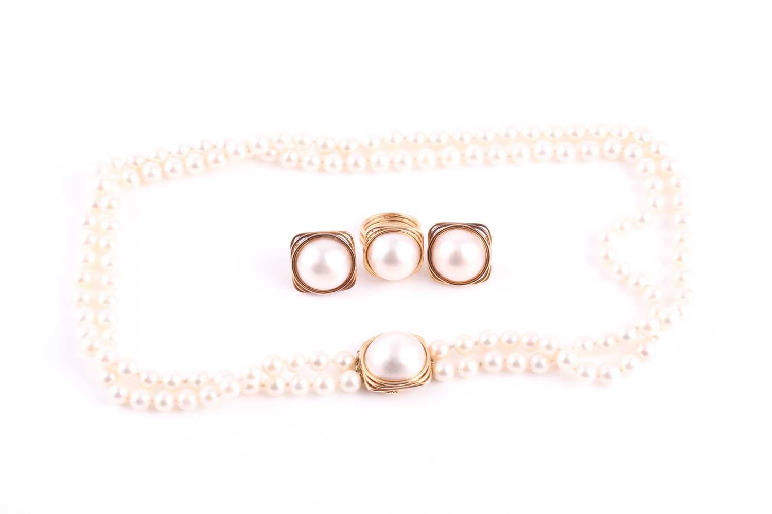 Lot 180 - A lot of 1970's style mabe pearl set necklace,...