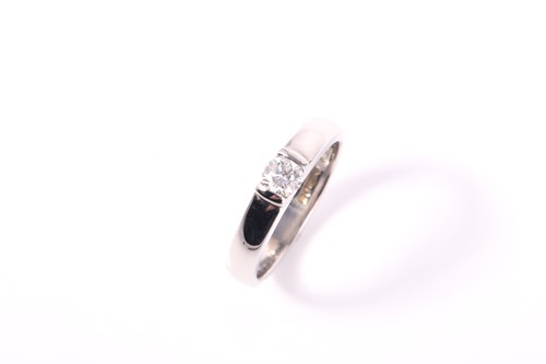 Lot 196 - A platinum diamond solitaire ring, set with a...