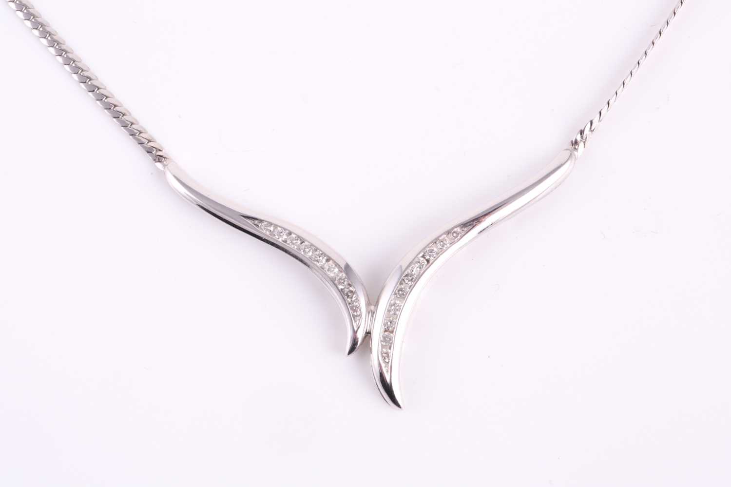 Lot 100 - A 9ct white gold and diamond necklace, channel...