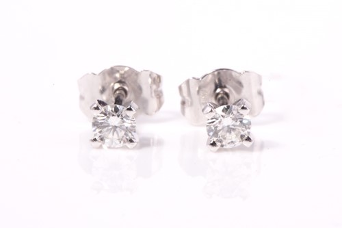 Lot 121 - A pair of platinum diamond studs earrings, 4...
