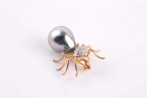 Lot 210 - A diamond and pearl spider brooch, set with...