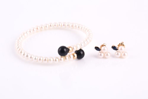 Lot 64 - A cultured pearl spring bracelet with gold...