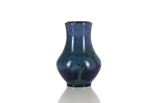 Lot 516 - A William Moorcroft pottery vase decorated in...