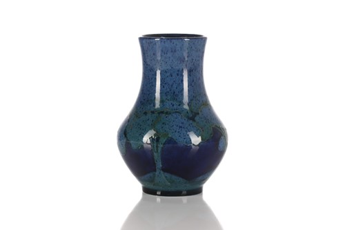 Lot 516 - A William Moorcroft pottery vase decorated in...