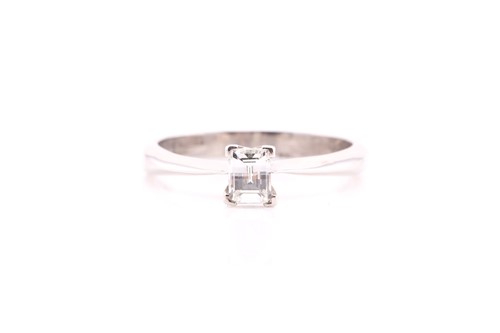 Lot 405 - A diamond single stone ring; the emerald cut...