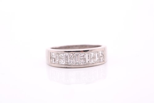 Lot 328 - A diamond half hoop eternity ring; composed of...