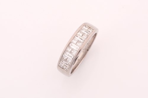 Lot 328 - A diamond half hoop eternity ring; composed of...