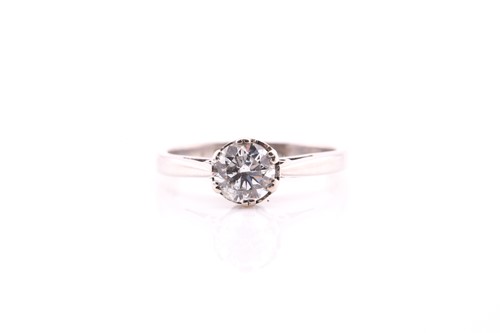 Lot 364 - A single stone diamond ring; the round...