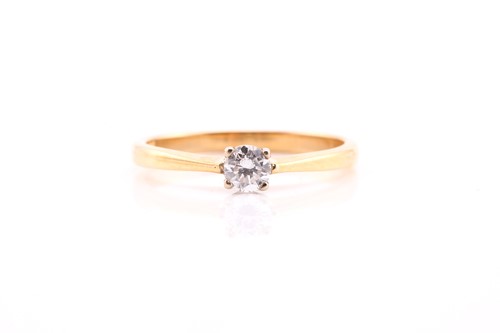 Lot 853 - A single stone diamond ring; the round...