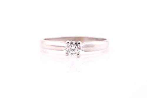 Lot 216 - A single stone diamond ring; the round...