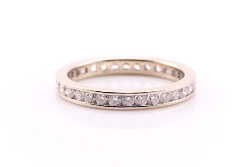 Lot 756 - A diamond full hoop eternity ring; the round...