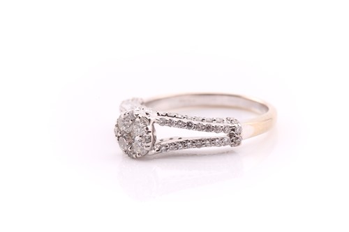 Lot 26 - A diamond cluster ring; the central circular...