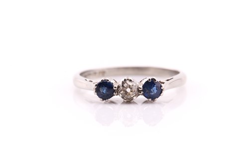 Lot 419 - A sapphire and diamond three stone half hoop...