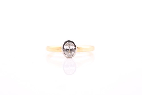 Lot 86 - A single stone oval cut diamond ring, in rub...