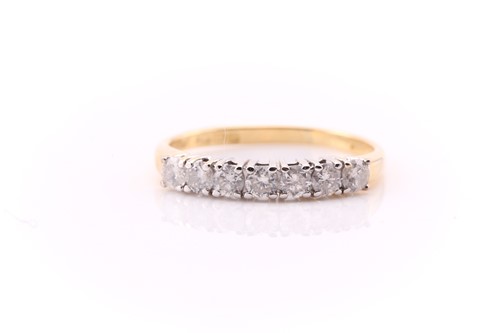 Lot 743 - A seven stone half hoop diamond half eternity...